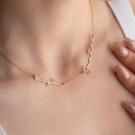 Woman wearing custom 2 name necklace in gold plated over 925k Silver - available with 2-5 names
